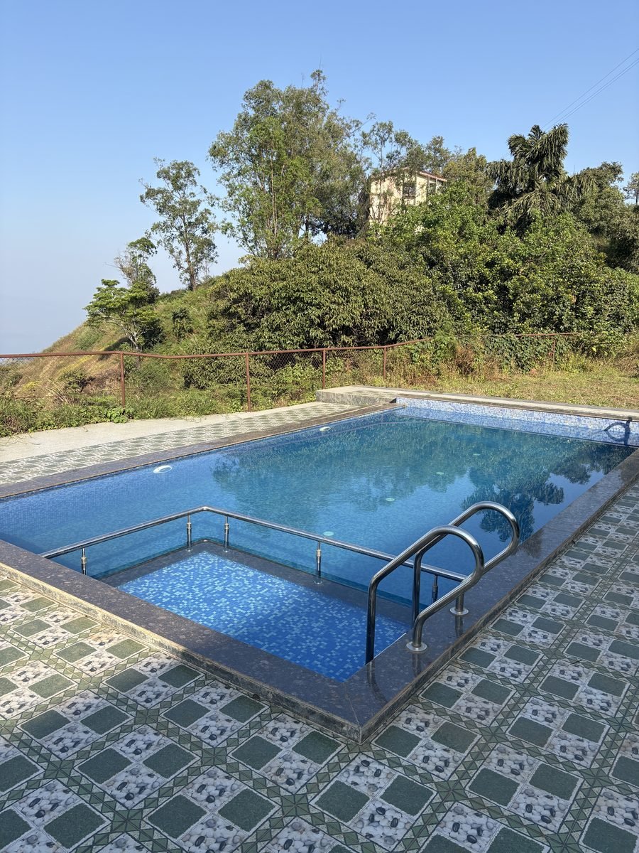 Hilltop swimming pool at Krishna Valley Resort with valley views, Panchgani